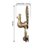 Peacock Majesty Knocker in handcrafted brass – mounted on a door