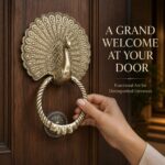 Peacock Plume Knocker in sand-cast solid brass – mounted on a door